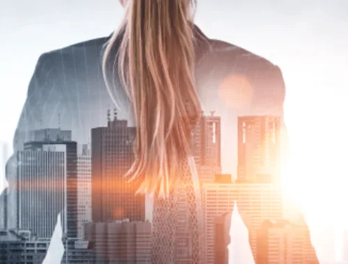 Double exposure of woman against skyscraper background
